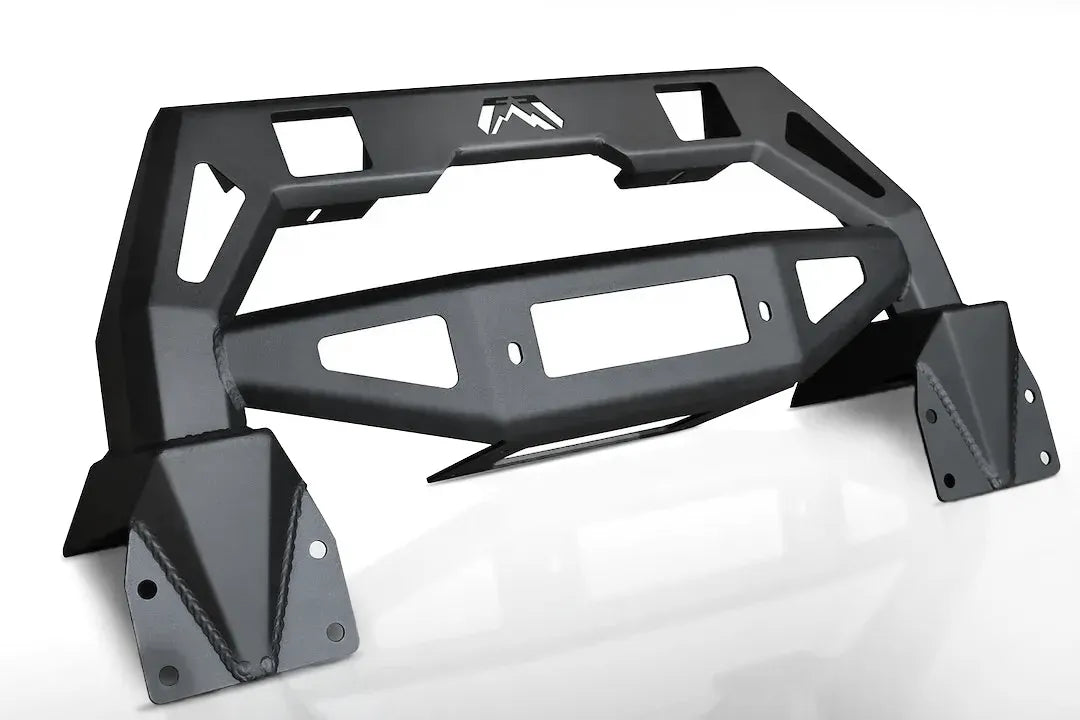 Black Fab Fours FMJ winch modifier with winch plate cutout, cube light openings, and bolt-on mounting brackets, angled view on a white background