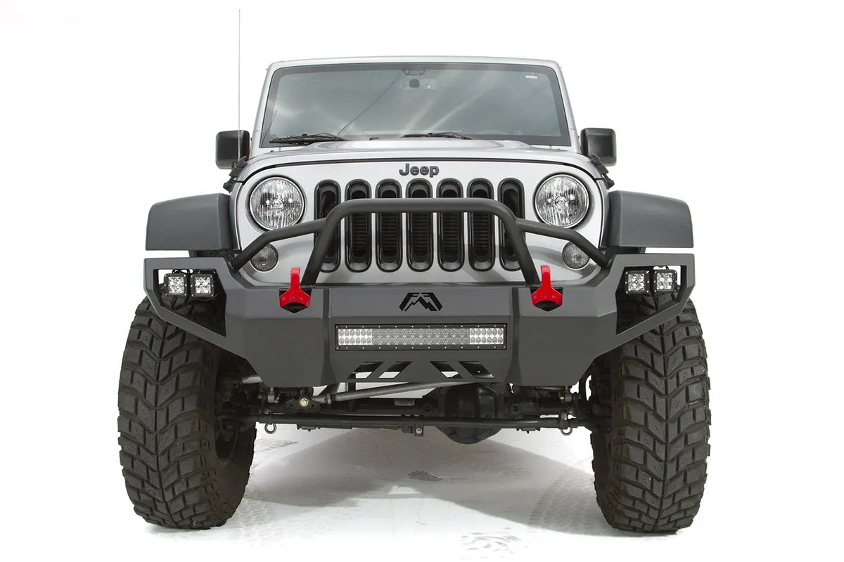 Fab Fours Vengeance front bumper with pre-runner guard on a silver Jeep Wrangler JK Rubicon, straight-on front view, showing the pre-runner hoop, center light bar and red shackles