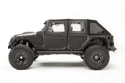 Fab Fours front and rear steel fenders on a lifted black Jeep Wrangler JK Unlimited, driver-side profile view