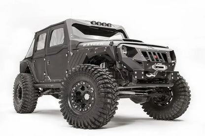 Fab Fours front steel fenders on a lifted black Jeep Wrangler JK Unlimited, passenger-side front three-quarter view, with Fab Fours grille guard and winch
