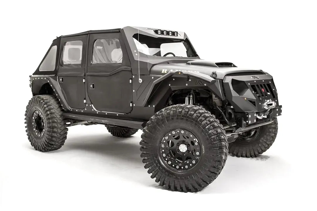 Fab Fours aggressive narrow front fender flares on a lifted black Jeep Wrangler JK Unlimited, front passenger-side view, showing the faceted steel flares with marker lights, along with a Fab Fours front bumper with winch, grille and ViCowl