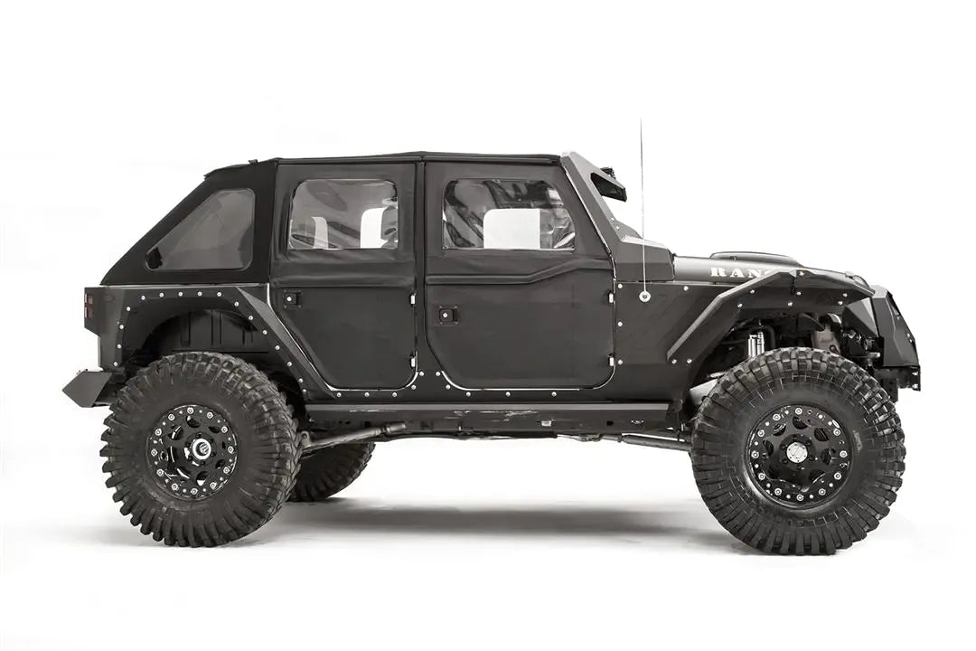 Fab Fours aggressive narrow front fender flare on a lifted black Jeep Wrangler JK Unlimited, passenger-side profile view, showing the flare and steel side armor over the front wheel