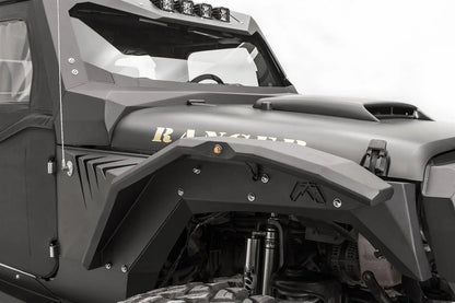 Close-up of Fab Fours fender gill box with angled vent slots behind the front fender flare on the passenger side of a black Jeep Wrangler JK