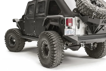 Fab Fours rear fender flare on a black 4-door Jeep Wrangler JK, close-up of the rear corner, showing the rear flare, riveted panel and wheel clearance