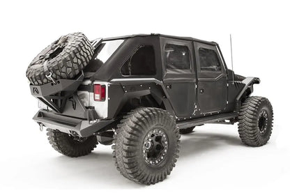 Fab Fours rear fender flare on a black 4-door Jeep Wrangler JK, rear passenger-side three-quarter view, showing the rear flare, wheel clearance and riveted body armor
