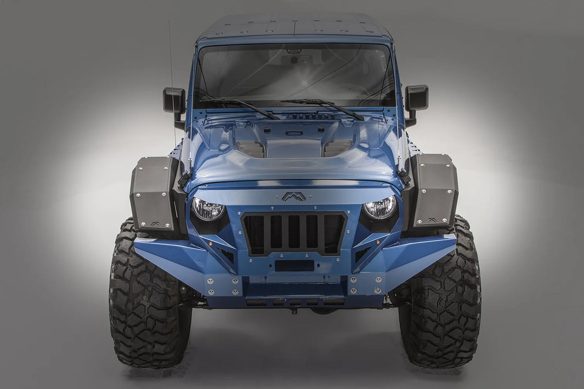 Fab Fours full-width front fender flares on a lifted blue Jeep Wrangler JL Rubicon, straight-on front view, showing the faceted black steel flares on both sides with a Fab Fours grille and matching blue front bumper