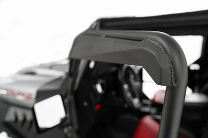 Fab Fours full tube doors on a lifted Jeep Wrangler JK Unlimited, driver-side profile view, showing black tubular front and rear doors with padded upper frames, along with Fab Fours fenders, body armor and limb risers