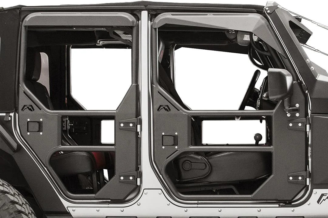 Fab Fours full tube door on a Jeep Wrangler JK, close-up of the padded upper window frame, showing the angled black cover over the tube with the interior and seats behind