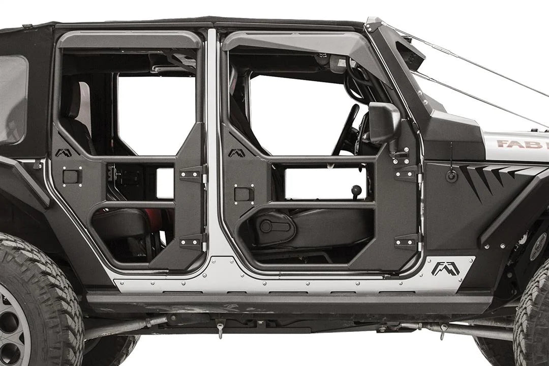 Fab Fours full tube doors on a Jeep Wrangler JK Unlimited, passenger-side close-up, showing the tubular frames, steel lower panels with Fab Fours logos, paddle latches and factory hinges