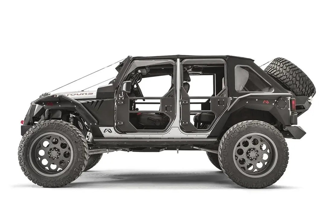 Fab Fours full tube doors on a Jeep Wrangler JK Unlimited, passenger-side view, showing the front and rear tube doors with steel lower panels, padded upper frames, paddle latches and Fab Fours logos