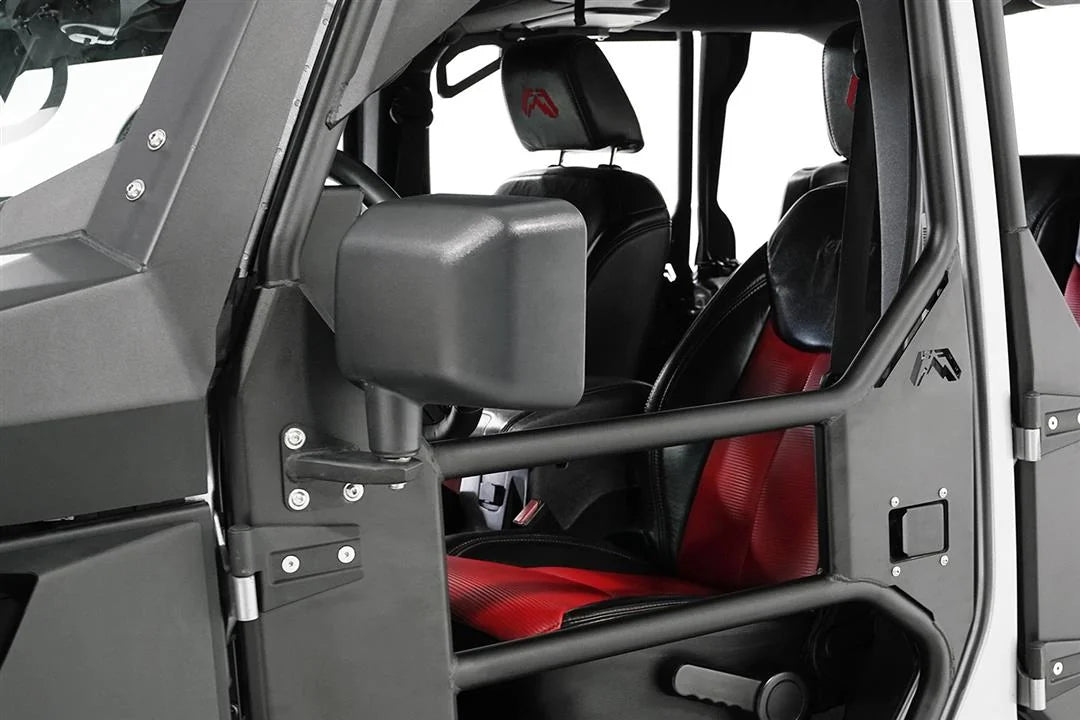Fab Fours door mirror bracket on a Jeep Wrangler JK fitted with Fab Fours tube doors, close-up of the driver side, showing the black mirror mounted to the door hinge plate with a red and black interior behind