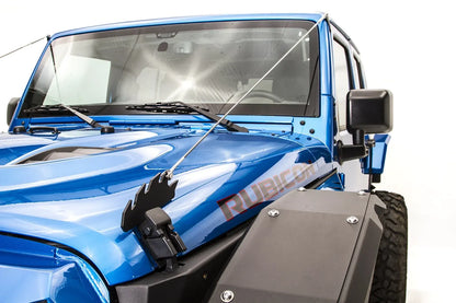 Fab Fours limb riser on a blue Jeep Wrangler JK Rubicon, close-up of the black steel hood anchor bracket with stainless cable running up to the windshield frame