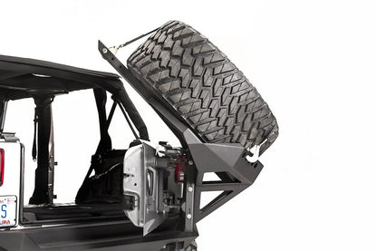 Fab Fours Slant Back Tire Carrier on a Jeep Wrangler JK, swung open with the tailgate for cargo access