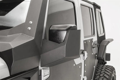 Fab Fours door skin mirror guard on a Jeep Wrangler JK, driver side, showing the faceted mirror housing on the steel door skin beside the cowl armor