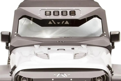 Close-up of the Fab Fours ViCowl Light Insert on a Jeep Wrangler JK, front view, showing four cube lights bolted into the insert plate at the top of the windshield cowl
