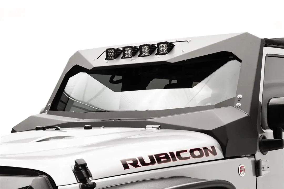 Fab Fours ViCowl Light Insert on a silver Jeep Wrangler JK Rubicon, driver-side view, showing four cube lights mounted in the angular steel windshield cowl