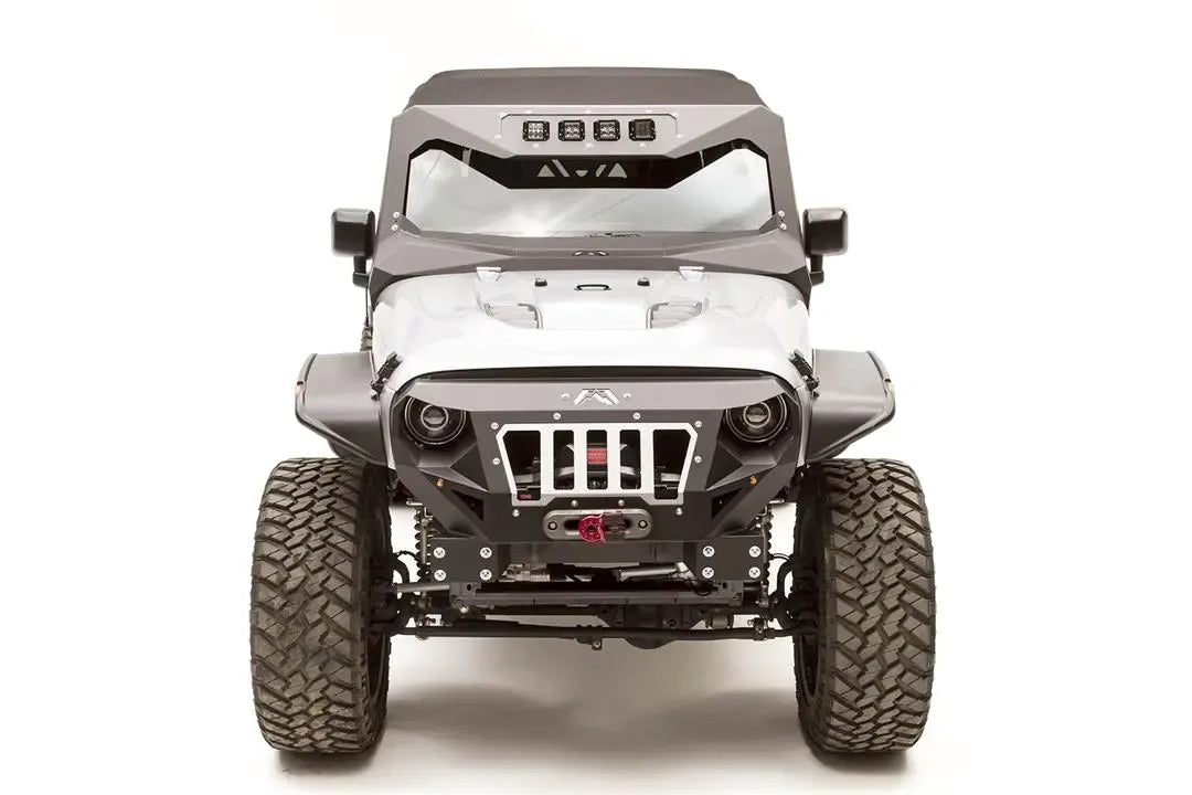 Fab Fours ViCowl Light Insert on a lifted silver Jeep Wrangler JK, front view, with four cube lights in the windshield cowl, matching fender flares and front bumper