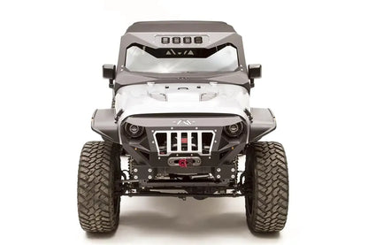 Fab Fours ViCowl Light Insert on a lifted silver Jeep Wrangler JK, front view, with four cube lights in the windshield cowl, matching fender flares and front bumper
