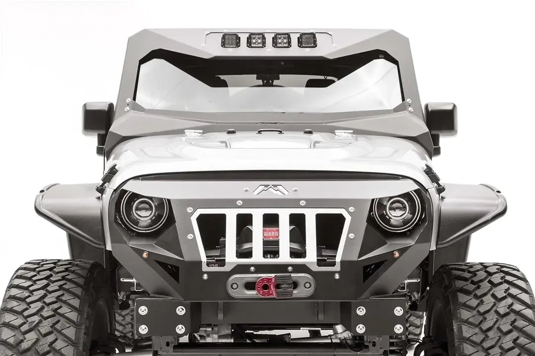 Fab Fours ViCowl Light Insert on a silver Jeep Wrangler JK, front view, holding four cube lights in the top of the steel windshield cowl above a Fab Fours grille guard and winch