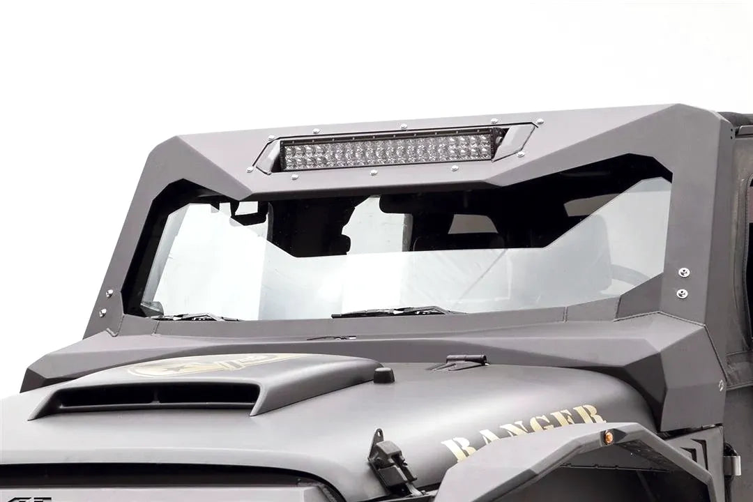 Fab Fours ViCowl Light Bar Insert Mount on a matte gray Jeep Wrangler JK, driver-side view, holding a 20-inch LED light bar in the top of the steel windshield cowl