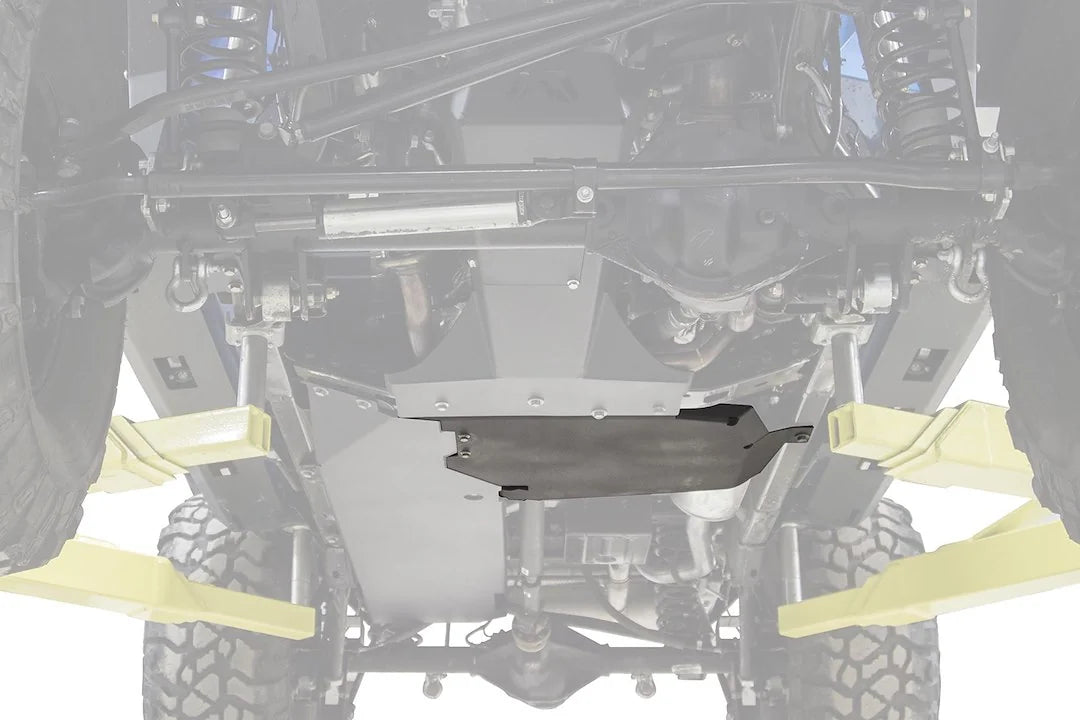Fab Fours transfer case skid plate on a Jeep Wrangler JK, underside view on a lift, with the black steel skid plate highlighted against the faded-out frame and suspension