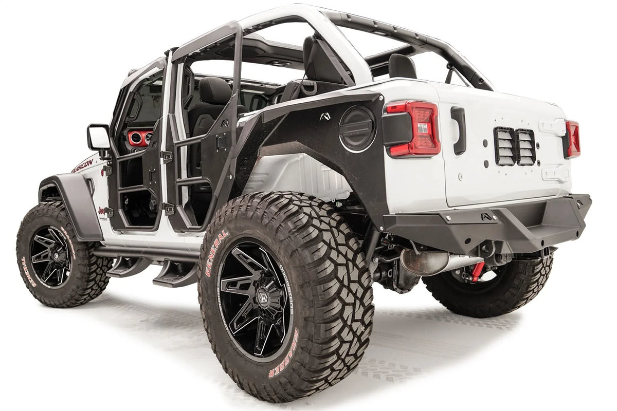 Fab Fours rear steel fender on a lifted white Jeep Wrangler JL Rubicon with tube doors, driver-side rear three-quarter view, with Fab Fours rear bumper