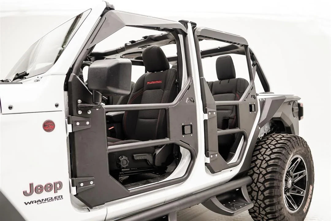 Fab Fours full tube doors on a white Jeep Wrangler JL Unlimited, angled driver-side close-up, showing the front door with mirror mount, factory hinges, paddle latch and padded upper frame