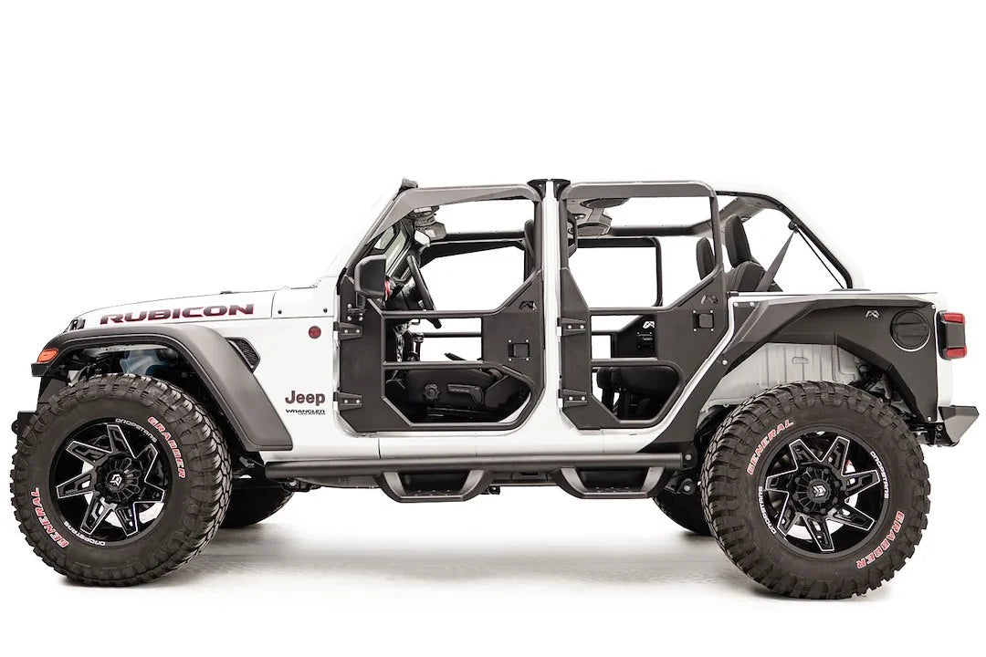 Fab Fours full tube doors on a lifted white Jeep Wrangler JL Rubicon Unlimited, driver-side profile view, showing all tube doors with padded upper frames, mirror mount and Fab Fours logos