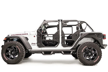 Fab Fours full tube doors on a lifted white Jeep Wrangler JL Rubicon Unlimited, driver-side profile view, showing all tube doors with padded upper frames, mirror mount and Fab Fours logos