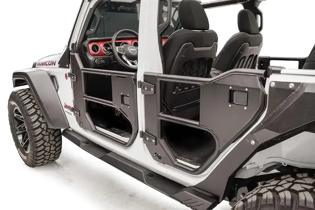 Fab Fours half tube doors on a white Jeep Wrangler JL Rubicon, close-up of the driver-side doors, showing the tubular frames, steel lower panels and hinge mounts