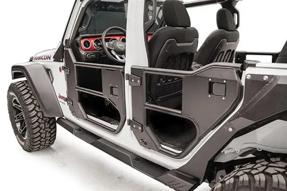 Fab Fours half tube doors on a white Jeep Wrangler JL, close-up of the driver side, showing the front and rear tube door frames, black powder-coated steel panels and open-air cab