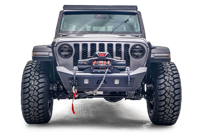 Fab Fours Stubby bumper on a gray Jeep Gladiator JT, straight-on front view, showing the low-profile bumper, centered winch and recessed light pods