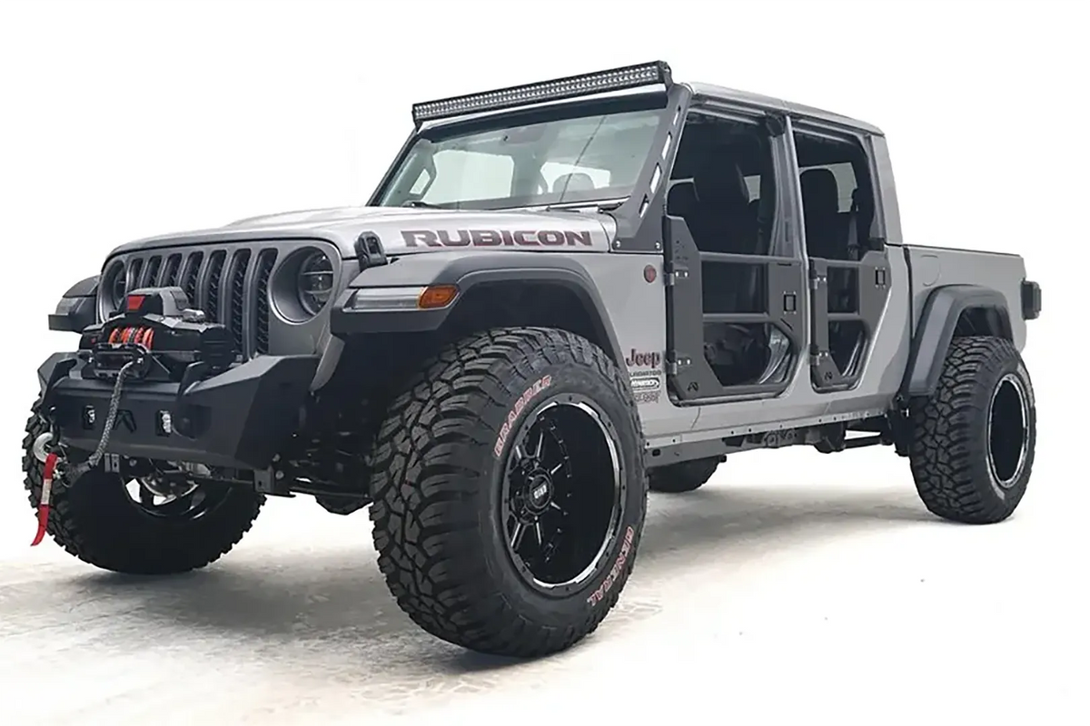 Fab Fours Stubby bumper on a gray Jeep Gladiator JT, driver-side front three-quarter view, showing the compact bumper, exposed winch and tube doors