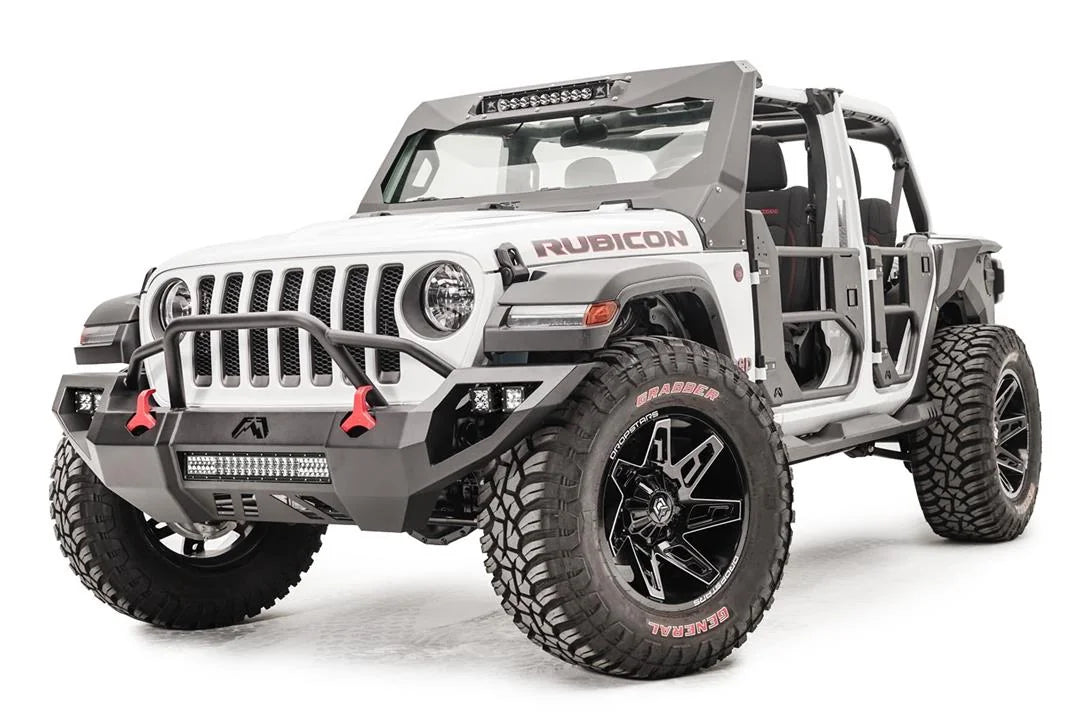 Fab Fours Vengeance front bumper with pre-runner guard on a white Jeep Wrangler JL, driver-side front three-quarter view, showing the tube hoop, LED light bar and red tow hooks