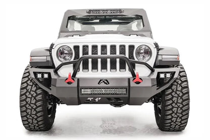 Fab Fours Vengeance front bumper with pre-runner guard on a white Jeep Wrangler JL, straight-on front view, showing the tube hoop, center LED light bar and red tow hooks