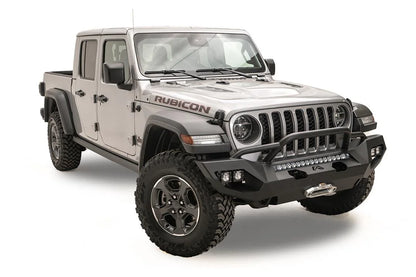 Fab Fours Matrix front bumper with pre-runner guard on a silver Jeep Gladiator JT, passenger-side front three-quarter view, showing the tube hoop, LED light bar and cube light pods