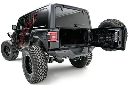 Fab Fours heavy-duty rear bumper on a lifted black Jeep Wrangler JL Unlimited with red graphics, driver-side rear three-quarter view, with tailgate open
