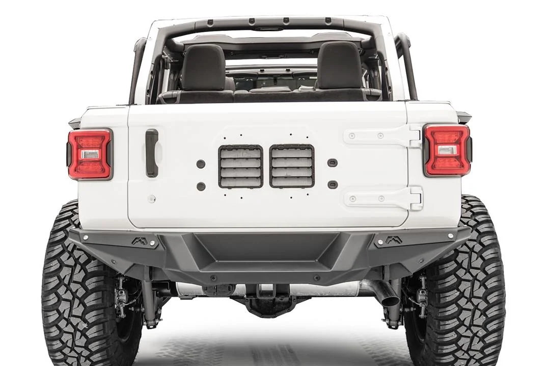 Fab Fours heavy-duty rear bumper on a white Jeep Wrangler JL with doors and top removed, straight rear view without spare tire, showing hitch receiver