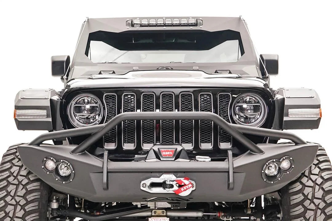 Fab Fours front fender flares with LED turn signals on a lifted black Jeep Wrangler JL, front view, with Fab Fours winch bumper and Warn winch