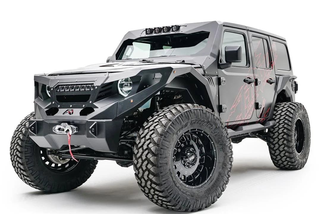Fab Fours ViCowl light insert on a lifted gray Jeep Wrangler JL Unlimited, front driver-side view, showing four pod lights on the ViCowl frame above a Fab Fours front bumper with winch, Fab Fours fenders and grille