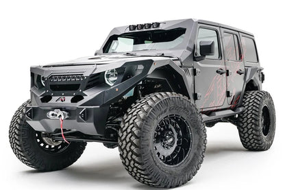 Fab Fours ViCowl light insert on a lifted gray Jeep Wrangler JL Unlimited, front driver-side view, showing four pod lights on the ViCowl frame above a Fab Fours front bumper with winch, Fab Fours fenders and grille