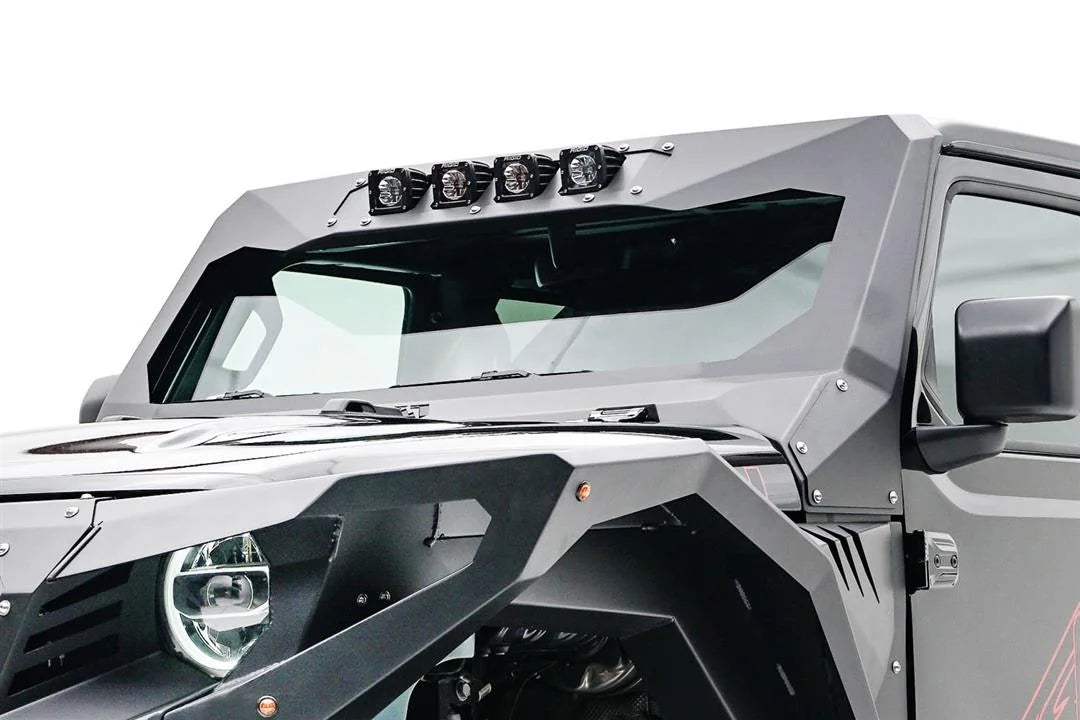 Fab Fours ViCowl light insert on a Jeep Wrangler JL, close-up from the driver side, showing four cube pod lights mounted across the top of the gray ViCowl windshield frame