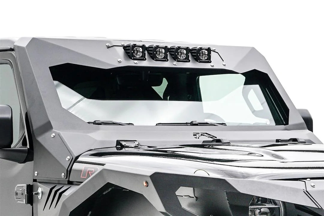 Fab Fours ViCowl light insert on a Jeep Wrangler JL, close-up from the passenger side, showing the four-pod light mount bolted into the top of the ViCowl windshield frame