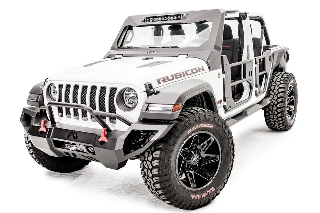 Fab Fours ViCowl light bar insert on a lifted white Jeep Wrangler JL Rubicon, front driver-side view, with the LED light bar in the cowl, a Fab Fours front bumper and tube doors