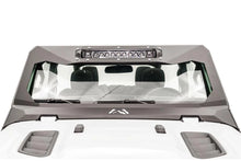 Fab Fours ViCowl light bar insert on a white Jeep Wrangler JL, front view, holding a single LED light bar across the top of the matte black steel windshield cowl