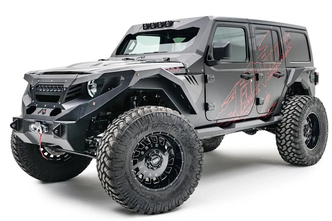 Fab Fours front fenders with gill vents on a lifted black Jeep Wrangler JL Unlimited, driver-side front three-quarter view, with Fab Fours winch bumper and cowl armor