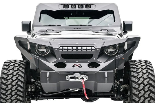 Fab Fours front fenders with amber marker lights on a lifted black Jeep Wrangler JL, front view, with Fab Fours winch bumper, Warn winch, and cowl light bar
