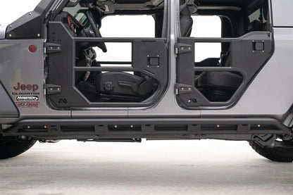 Close-up of the Fab Fours tube rock slider on a Jeep Gladiator, driver side, showing the double-tube rail