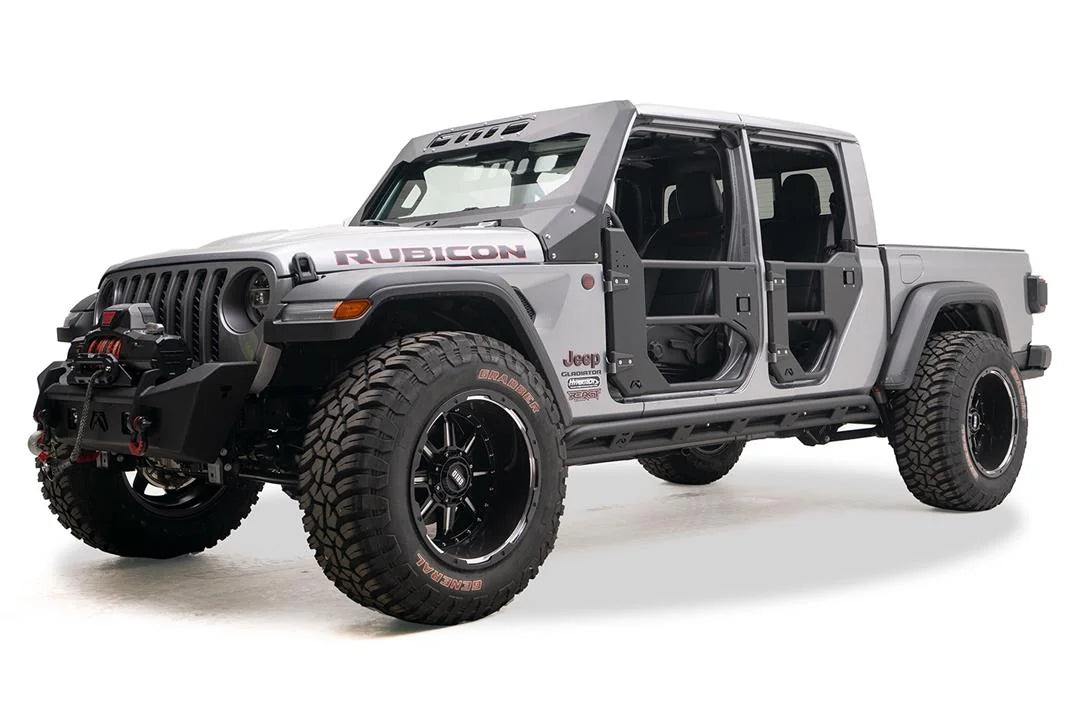 Fab Fours tube rock slider on a silver Jeep Gladiator Rubicon, front driver-side view