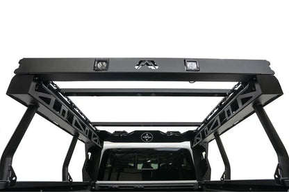 Fab Fours Overland Rack on a white Jeep Gladiator, rear view from the bed, showing two additional crossmembers spanning the platform between the side rails